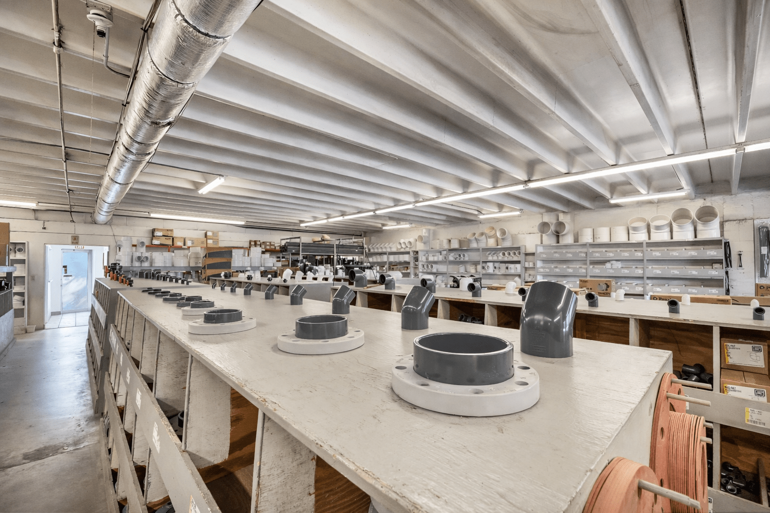 Warehouse interior with plumbing supplies on shelves