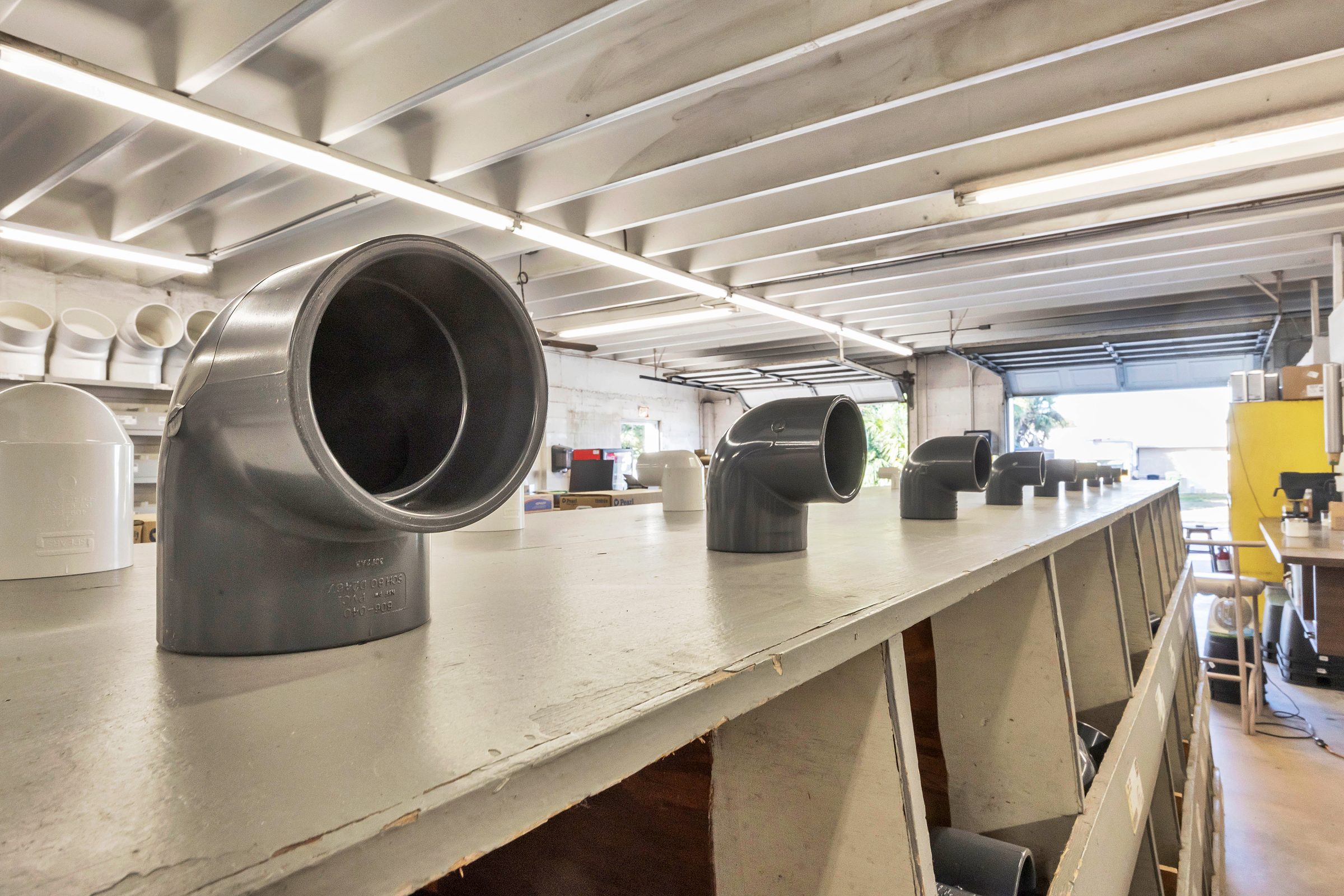 PVC pipe connectors on warehouse shelf