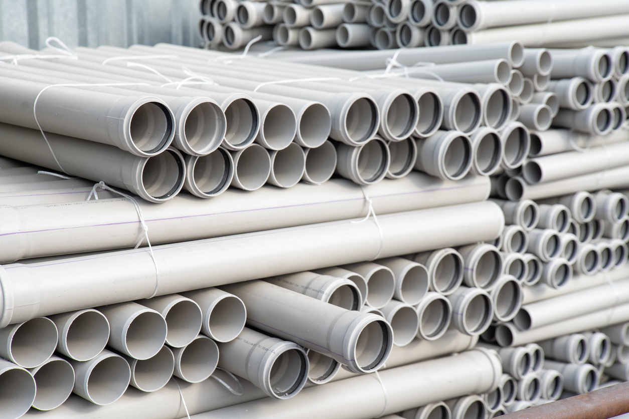 Stacks of PVC pipes in storage
