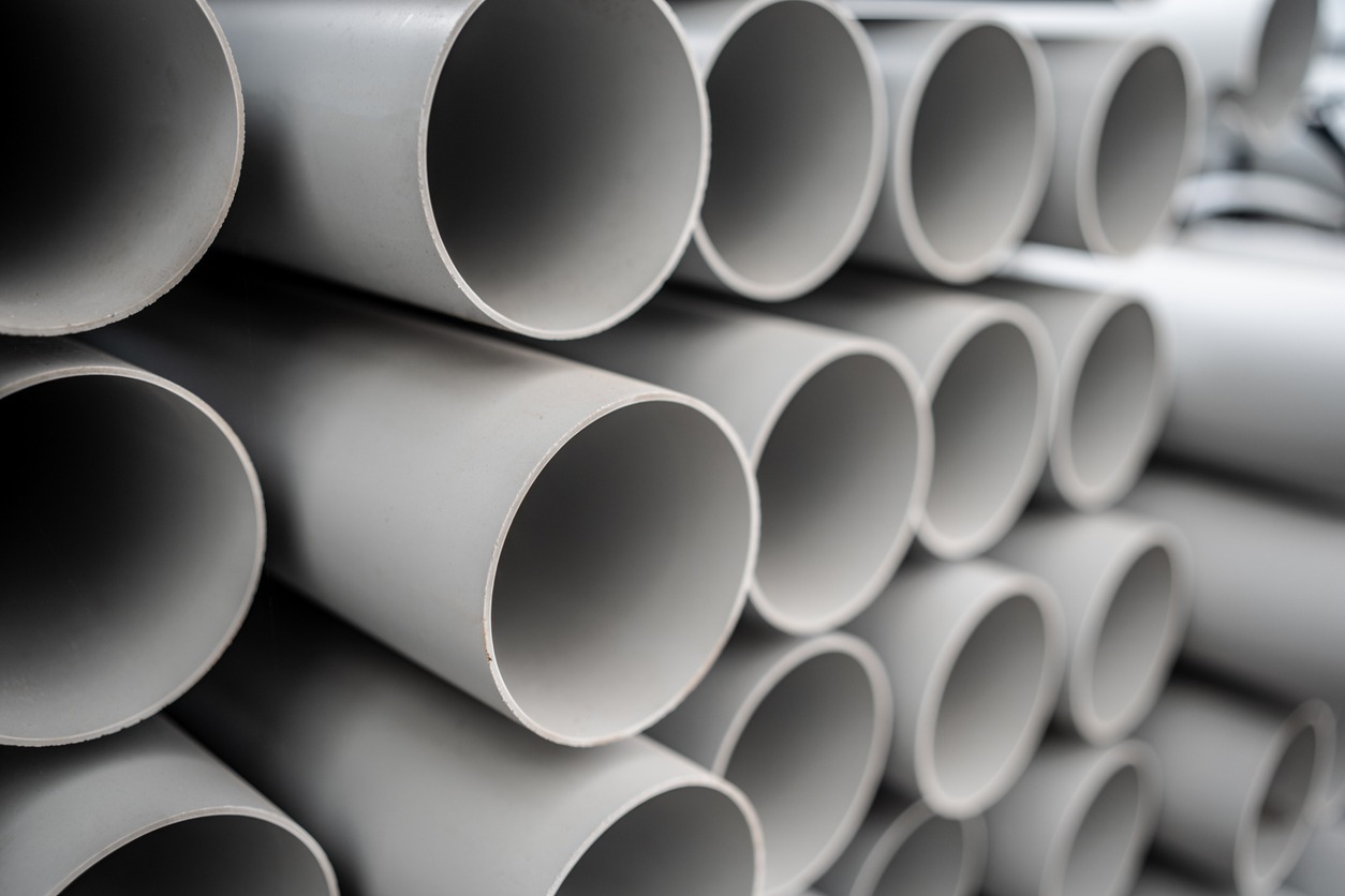 Stack of gray plastic pipes