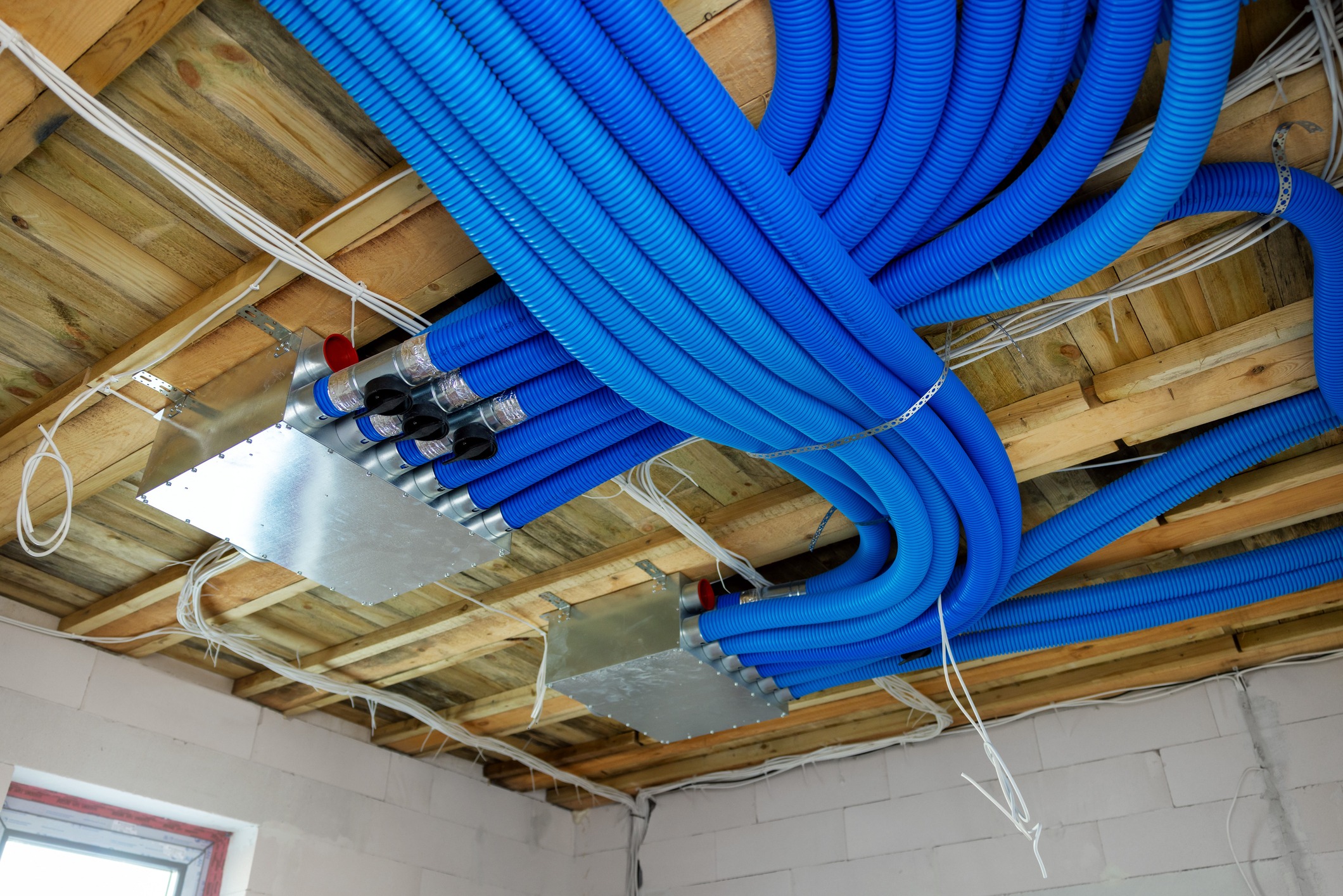 Blue ventilation ducts installed on ceiling